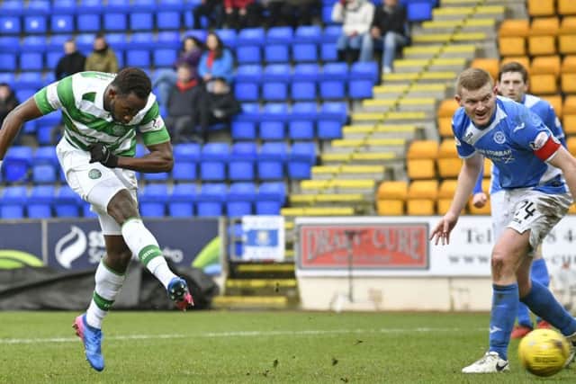 Moussa Dembele sweeps home his third goal against St Johnstone. Picture: SNS.
