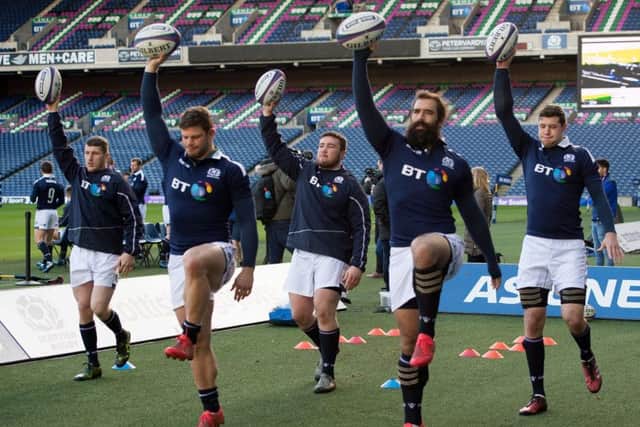 Zander Fagerson, centre, says Scotland will not get carried away. Picture: PA.