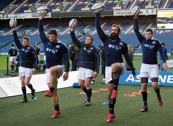 Zander Fagerson, centre, says Scotland will not get carried away. Picture: PA.