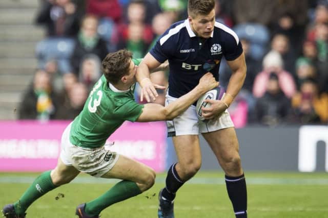 Huw Jones is tackled by Ireland's Garry Ringrose. Picture: SNS/SRU.