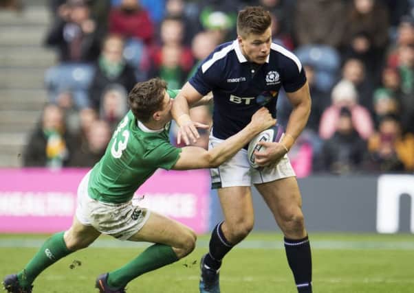 Huw Jones is tackled by Ireland's Garry Ringrose. Picture: SNS/SRU.