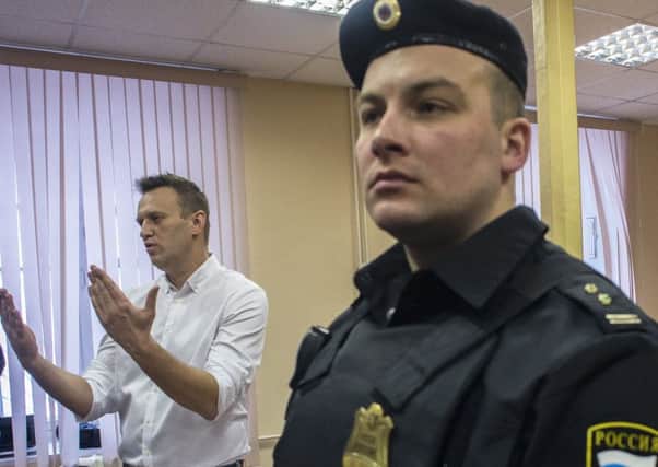 Alexei Navalny, left, at Kirovs Leninsky District Court. Picture: Getty Images