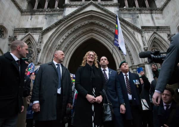 Claire Blackman, wife of imprisoned marine Alexander Blackman, outside the court with supporters. Picture: AFP/Getty Images