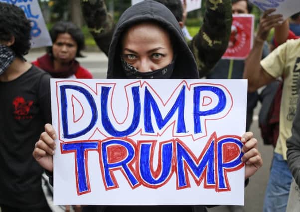 Donald Trump's immigration ban has sparked protests around the world. Picture: Dita Alangkara/AP