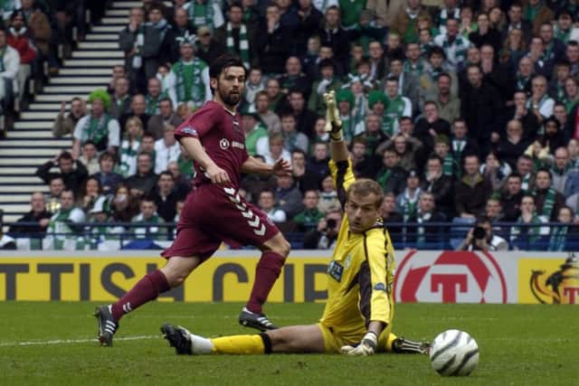 Paul Hartley flicks the ball past Zbigniew MaBkowski for the opening goal of the 2006 semi-final. Picture: Donald MacLeod