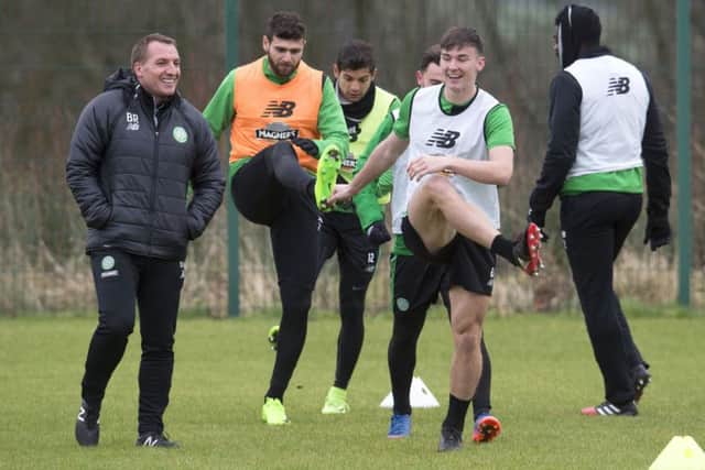 Celtic manager Brendan Rodgers, left, and Kieran Tierney share a joke during training. Picture: Craig Foy/SNS