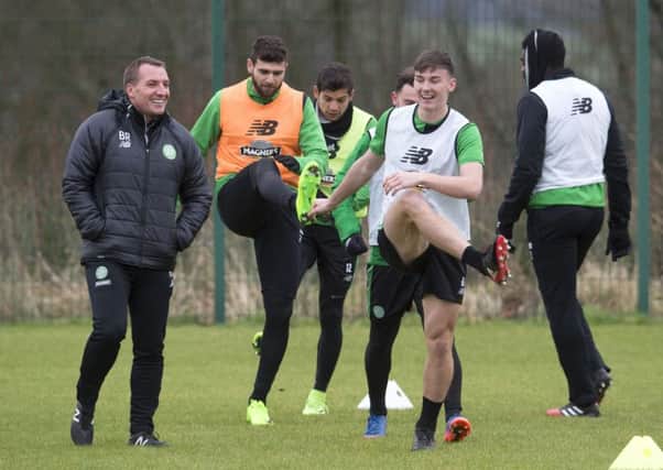 Celtic manager Brendan Rodgers, left, and Kieran Tierney share a joke during training. Picture: Craig Foy/SNS