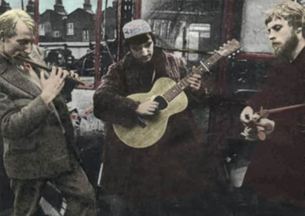 From left, Clive Palmer, Mike Heron and Robin Williamson put on a street performance back in the early years of the Incredible String Band