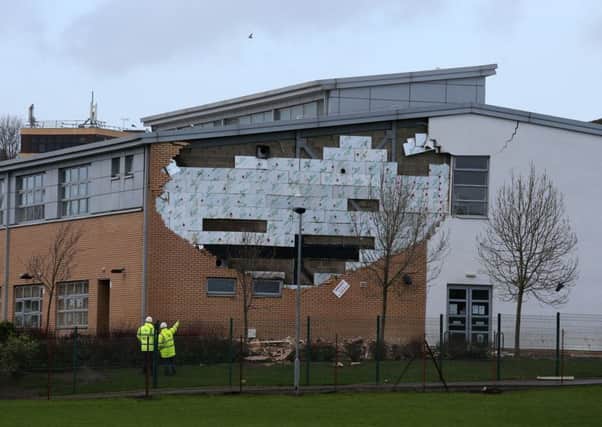 The  collapsed wall at Oxgangs Primary School in Edinburgh. That there were no injuries or fatalities to children was just down to luck, says scathing report.