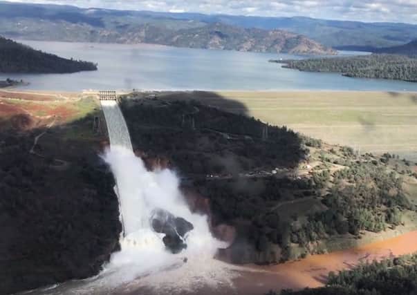Water flowing over an emergency spillway of the Oroville Dam in California where 188,000 people have been told to evacuate their homes. Picture: AP