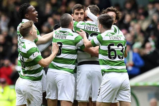 Celtic players celebrate Mikael Lustig's opening goal in the 6-0 thrashing of Inverness CT. Picture: SNS/Craig Williamson