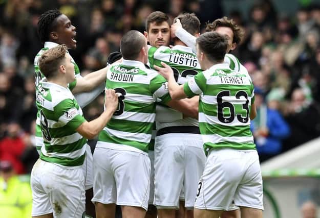 Celtic players celebrate Mikael Lustig's opening goal in the 6-0 thrashing of Inverness CT. Picture: SNS/Craig Williamson
