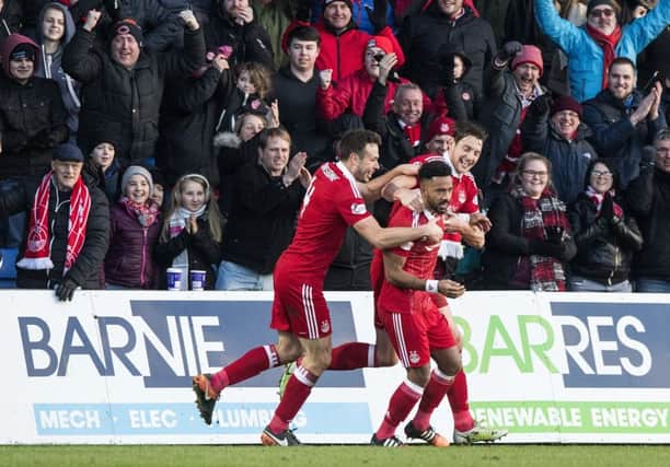 Shay Logan celebrates the winning goal as Aberdeen knock out ROss County. Picture: SNS/Alan Harvey