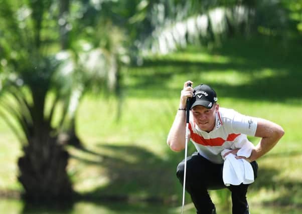 Danny Willett lines up a putt during the Maybank Championship Malaysia at Saujana Golf Club. Picture: Stuart Franklin/Getty Images
