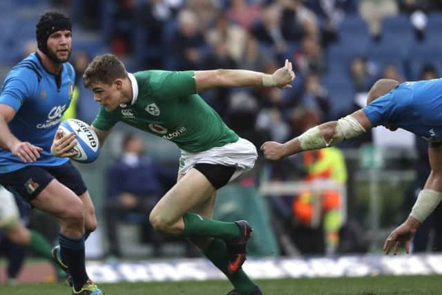 Irelands Garry Ringrose on his way to score as Italys Sergio Parisse, right, tries to halt him in the Olympic Stadium.  Photograph: Alessandra Tarantino/AP