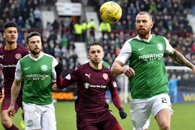 Jordan Forster keeps his eye on the ball, with Sam Nicholson, Lewis Stevenson and Bjorn Johnsen in attendance. Picture: SNS.
