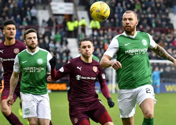 Jordan Forster keeps his eye on the ball, with Sam Nicholson, Lewis Stevenson and Bjorn Johnsen in attendance. Picture: SNS.