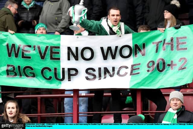 Hibs supporters remind their hosts of David Grays late cup-winning goal in last years final. Picture: Getty.
