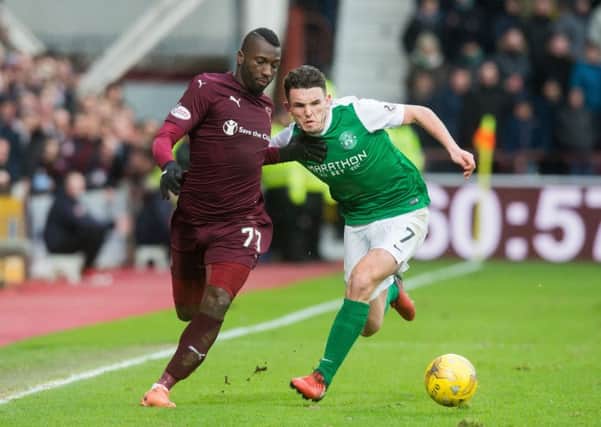 Esmael Goncalves and John McGinn battle for possession. Picture: Ian Georgeson