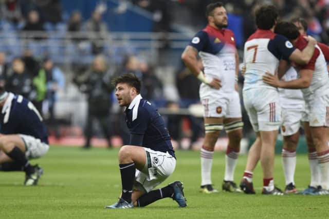 Despair for replacement scrum-half Ali Price as the French players celebrate.
Picture: Ian Rutherford