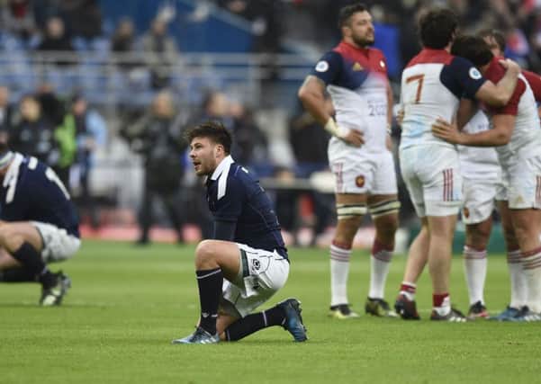 Despair for replacement scrum-half Ali Price as the French players celebrate.

Picture: Ian Rutherford