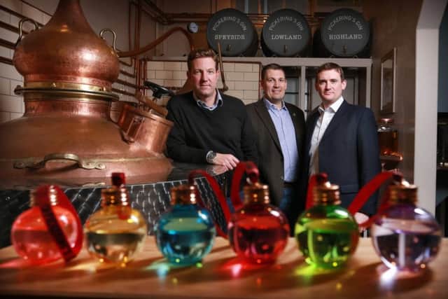 From left: Marcus Pickering and Matthew Gammell of Pickering's Gin with LendingCrowd's Stuart Lunn. Picture: Stewart Attwood