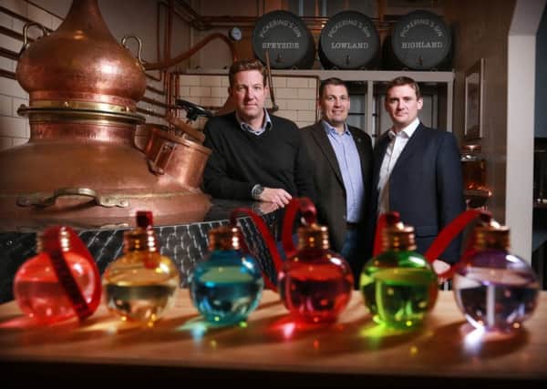 From left: Marcus Pickering and Matthew Gammell of Pickering's Gin with LendingCrowd's Stuart Lunn. Picture: Stewart Attwood