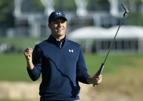 Jordan Spieth celebrates after putting out on the 18th green to win the AT&T Pebble Beach Pro-Am. Picture: Jeff Gross/Getty Images