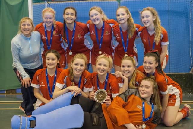 Craigholme School Under-18 hockey team, who have become the Scottish Indoor Champions, with their coach, Wendy Justice.