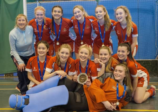 Craigholme School Under-18 hockey team, who have become the Scottish Indoor  Champions, with their coach, Wendy Justice.