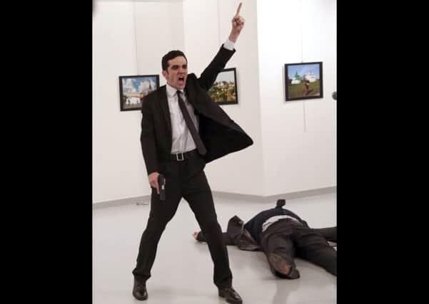 The overall winner of Andrey Karlovs assassination by MevlÃ¼t Mert Alt1nta_ by Burhan Ozbilicis. Picture: AP