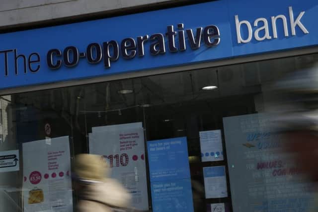 The Co-operative Bank is putting itself up for sale as it struggles to meet capital requirements designed to ensure financial institutions can survive hard times. Picture: Alastair Grant/AP