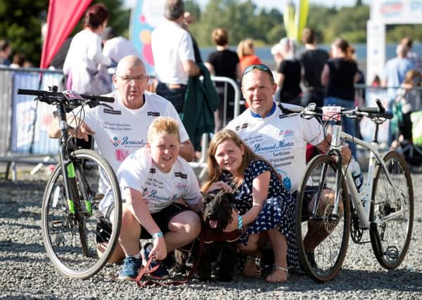 Reg and Barry Chisholm with Barrys children Aaron, 14, and Abbie, 12, and Hamish the dog. Picture: Contributed