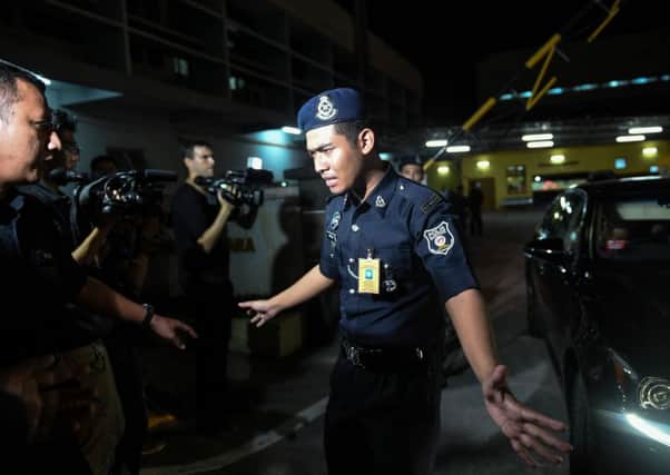 A policeman outside the forensic department where Kim Jong-nams body  is being kept at a hospital in Kuala Lumpur. Picture: AFP/Getty Images