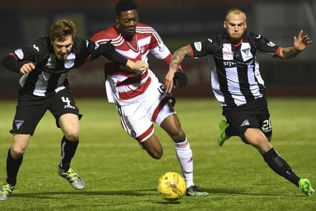 Dunfermline's Lewis Martin (left) and Kallum Higginbotham (right) with Rakish Bingham of Accies. Picture: Craig Williamson/SNS