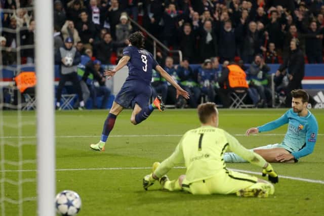 Edinson Cavani wheels away after scoring Paris St Germains fourth goal against Barcelona. Picture: AP