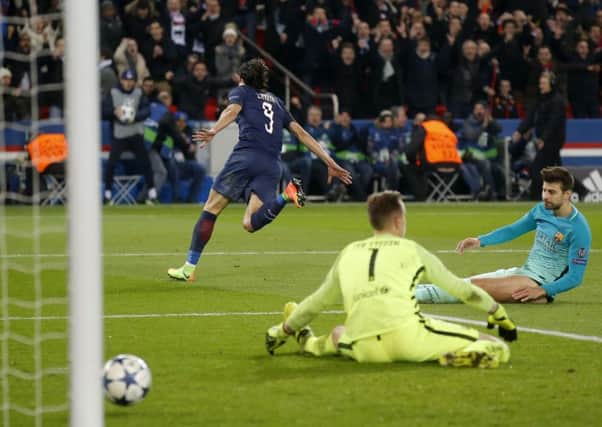 Edinson Cavani wheels away after scoring Paris St Germains fourth goal against Barcelona. Picture: AP