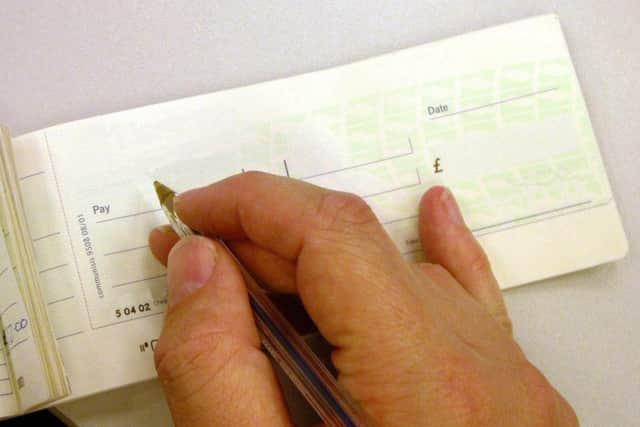 When's the last time you used your cheque book? Picture: PA