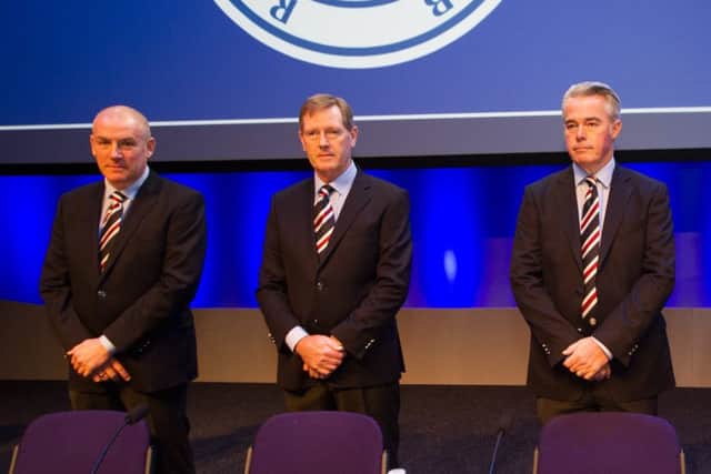 Mark Warburton, left, insists the version of events told by Dave King (centre) are not accurate. Picture: John Devlin