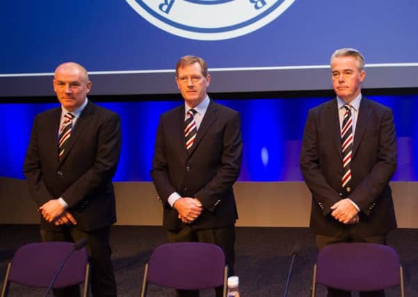 Mark Warburton, left, insists the version of events told by Dave King (centre) are not accurate. Picture: John Devlin