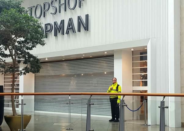 The scene outside Topshop in Reading, Berkshire, where a 10-year-old boy reportedly died from severe head injuries following an incident involving shop furniture.