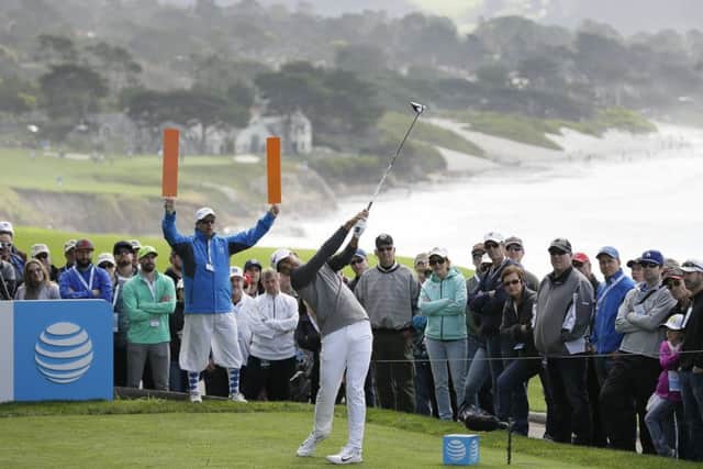 Jason Day, pictured playing at Pebble Beach last week, could lose his No 1 world ranking. Picture: Eric Risberg/AP