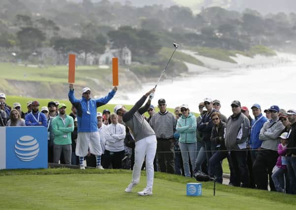 Jason Day, pictured playing at Pebble Beach last week, could lose his No 1 world ranking. Picture: Eric Risberg/AP