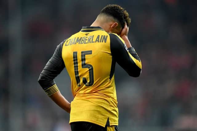 Arsenal's Alex Oxlade Chamberlain looks dejected after the 5-1 defeat by Bayern Munch in the Champions League round of 16 first leg match. Picture: Matthias Hangst/Bongarts/Getty Images