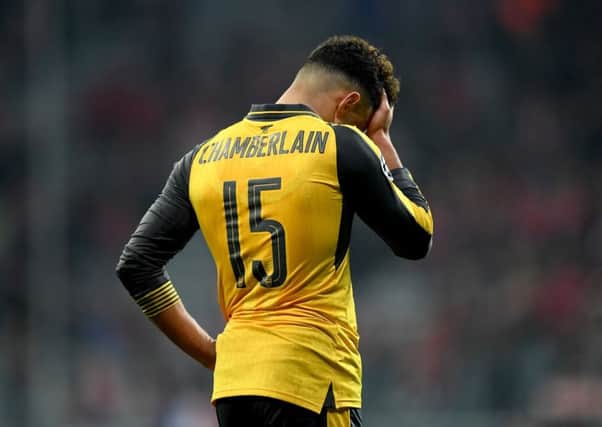 Arsenal's Alex Oxlade Chamberlain looks dejected after the 5-1 defeat by Bayern Munch in the Champions League round of 16 first leg match. Picture: Matthias Hangst/Bongarts/Getty Images