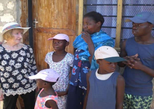 Margaret Bayne with the Kenyan family she helped. Picture: Contributed