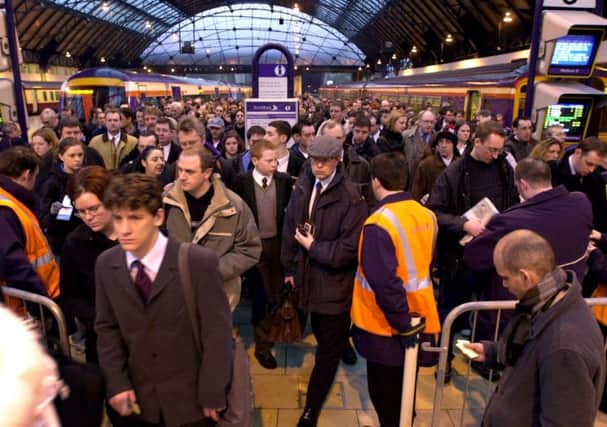 Commuters alight at Queen Street from the 7.15am service from Edinburgh Waverley in February 2002. Picture: Ian Rutherford/TSPL