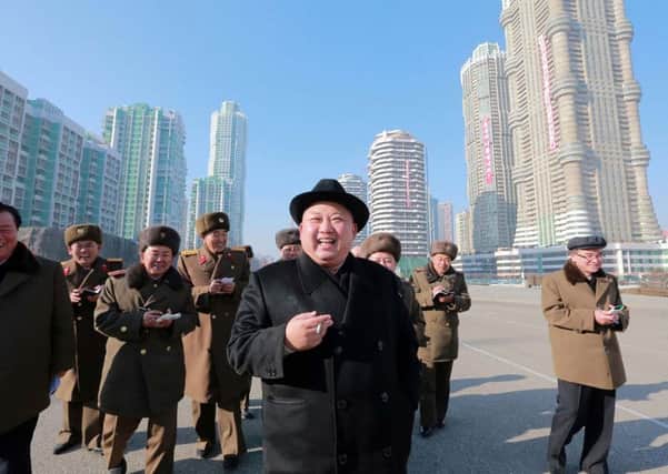 Kim
Jong-un inspects the construction of housing blocks in Pyongyang. Picture: STR/AFP/Getty