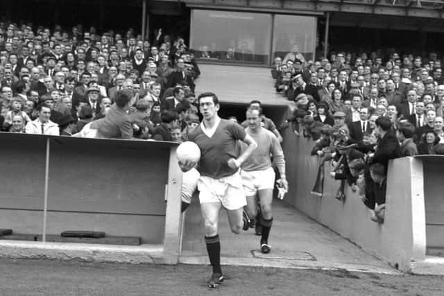 Rangers captain John Greig runs onto the pitch in August 1966. Picture: TSPL