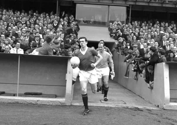 Rangers captain John Greig runs onto the pitch in August 1966. Picture: TSPL